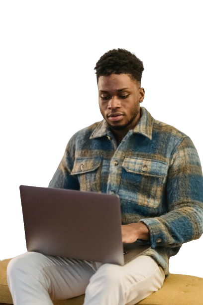 a man sitting with his laptop